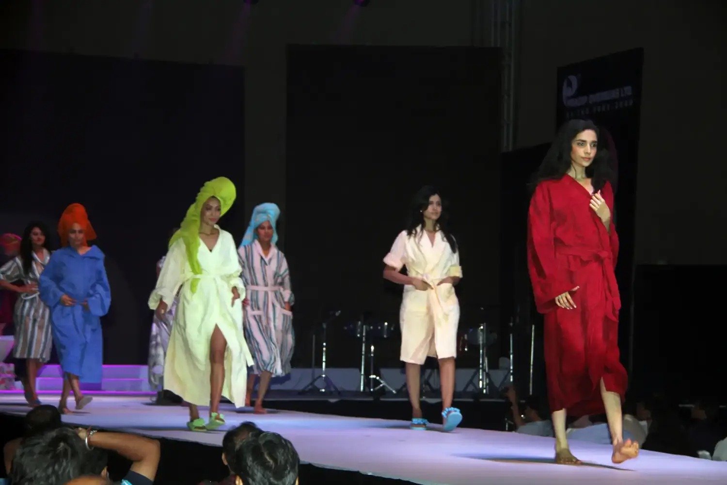 Man in suit speaking at podium with ITT logo on podium